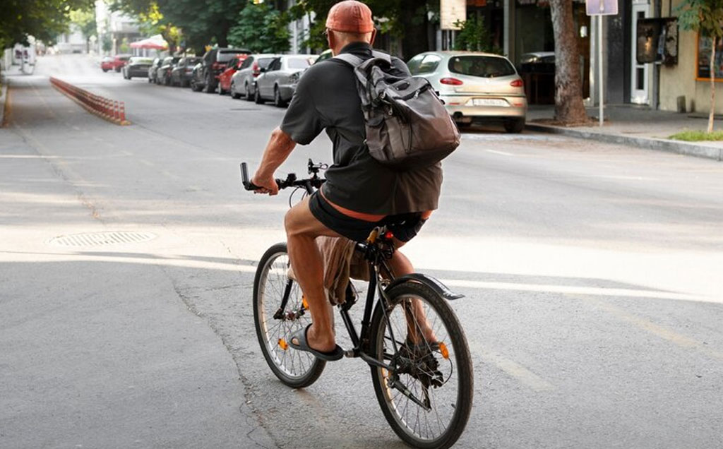 Person Riding Electric Cycle with & without Helmet